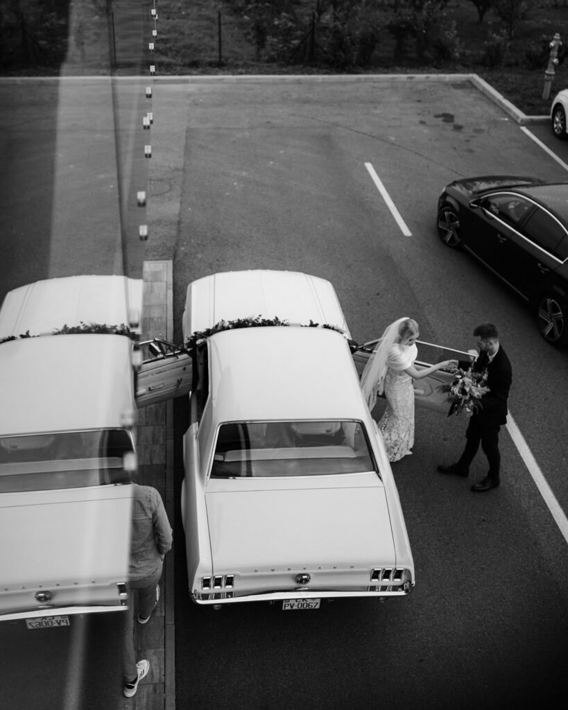 Couple arriving at the venue in a mustang
